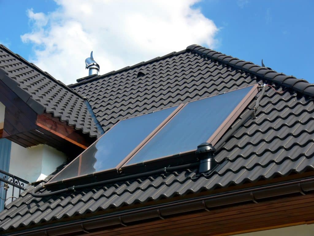 Roof with solar panels on sunny day.